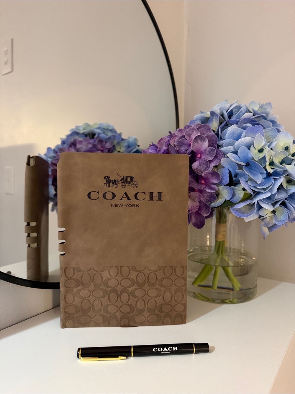 COACH Brown Signature Leather Notebook - COACH New York with a Pen